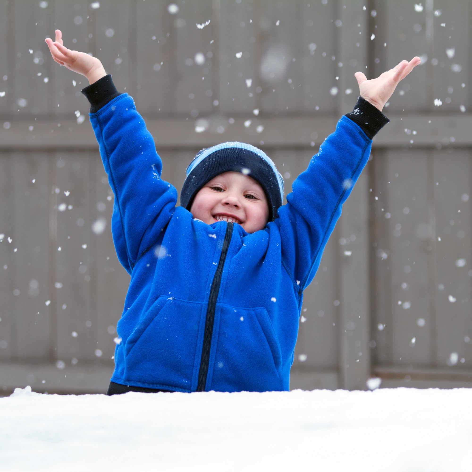 Smiling boy in the snow.